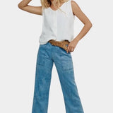 Jungmaven light hemp vest styled with blue denim pants sunglasses front view