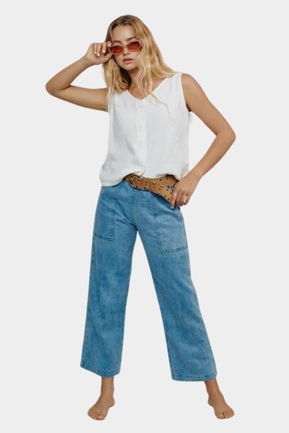 Jungmaven light hemp vest styled with blue denim pants sunglasses front view