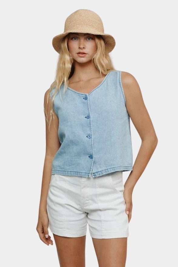 Jungmaven light denim sleeveless vest styled with white shorts front view