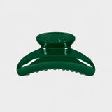 Karst Super Hair Clip in Evergreen with a glossy curved silhouette and embossed logo, available at YUCCA Denver.