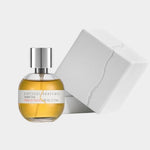 Ambré Oud perfume by Kintsugi Perfumes beside white presentation box, available at YUCCA Denver