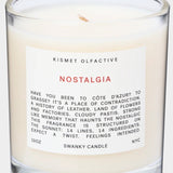 Kismet Olfactive Nostalgia Candle in clear glass vessel with organic wax blend