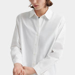 Kowtow Daily Shirt in white close up showing relaxed fit and button placket