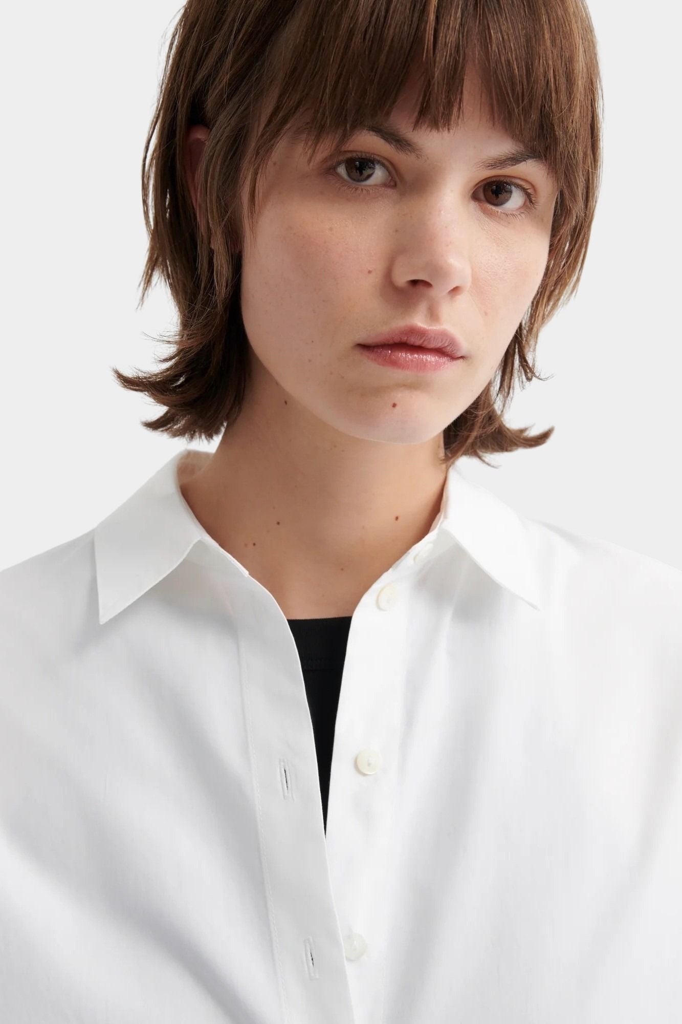 Kowtow Daily Shirt in white close up showing collar and button front detail
