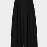 Front product view of the black Kowtow Drape Pant showing its pleats and full, wide legs.