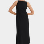Front view of the black Low Back Dress with a wide neckline and flowing ankle length skirt