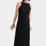 Kowtow Low Back Dress in black worn with black lace up shoes, angled front view