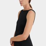 Side detail of the black Kowtow Low Back Dress showing its wide neckline and sleeveless bodice at YUCCA Denver