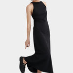 Kowtow Low Back Dress in black worn with black lace up shoes, full length front view