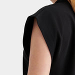 Kowtow Method Tank in black close up showing high neckline and structured cap sleeve