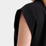 Kowtow Method Tank in black close up showing high neckline and structured cap sleeve