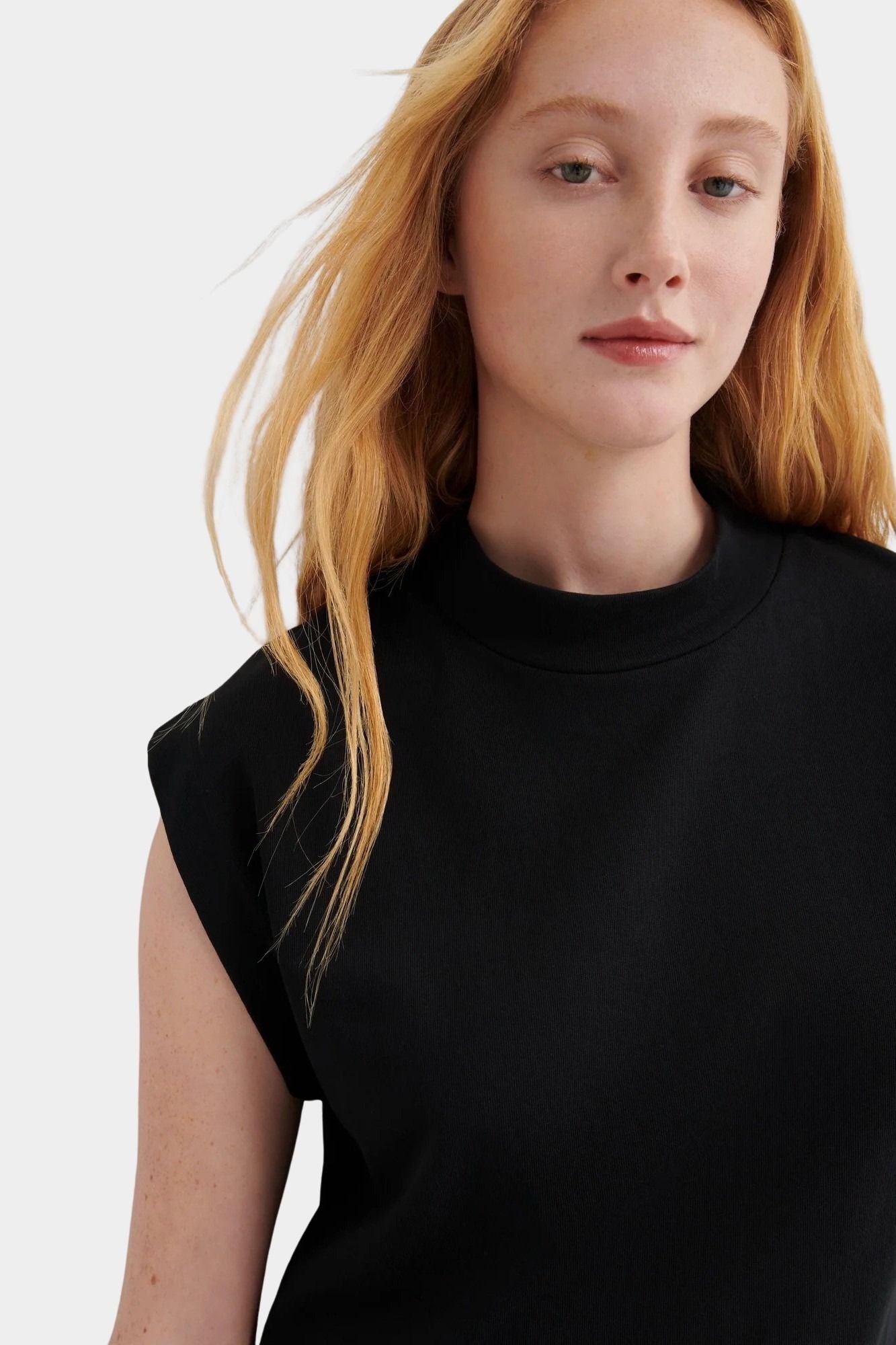 Kowtow Method Tank in black side detail showing sculpted shoulder and relaxed fit