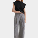 Kowtow Method Tank in black worn with striped wide leg trousers, full length view