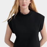 Kowtow Method Tank in black worn with striped wide leg trousers, front view