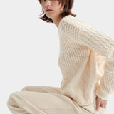 Kowtow chalk patchwork jumper textured knit sweater side seated view