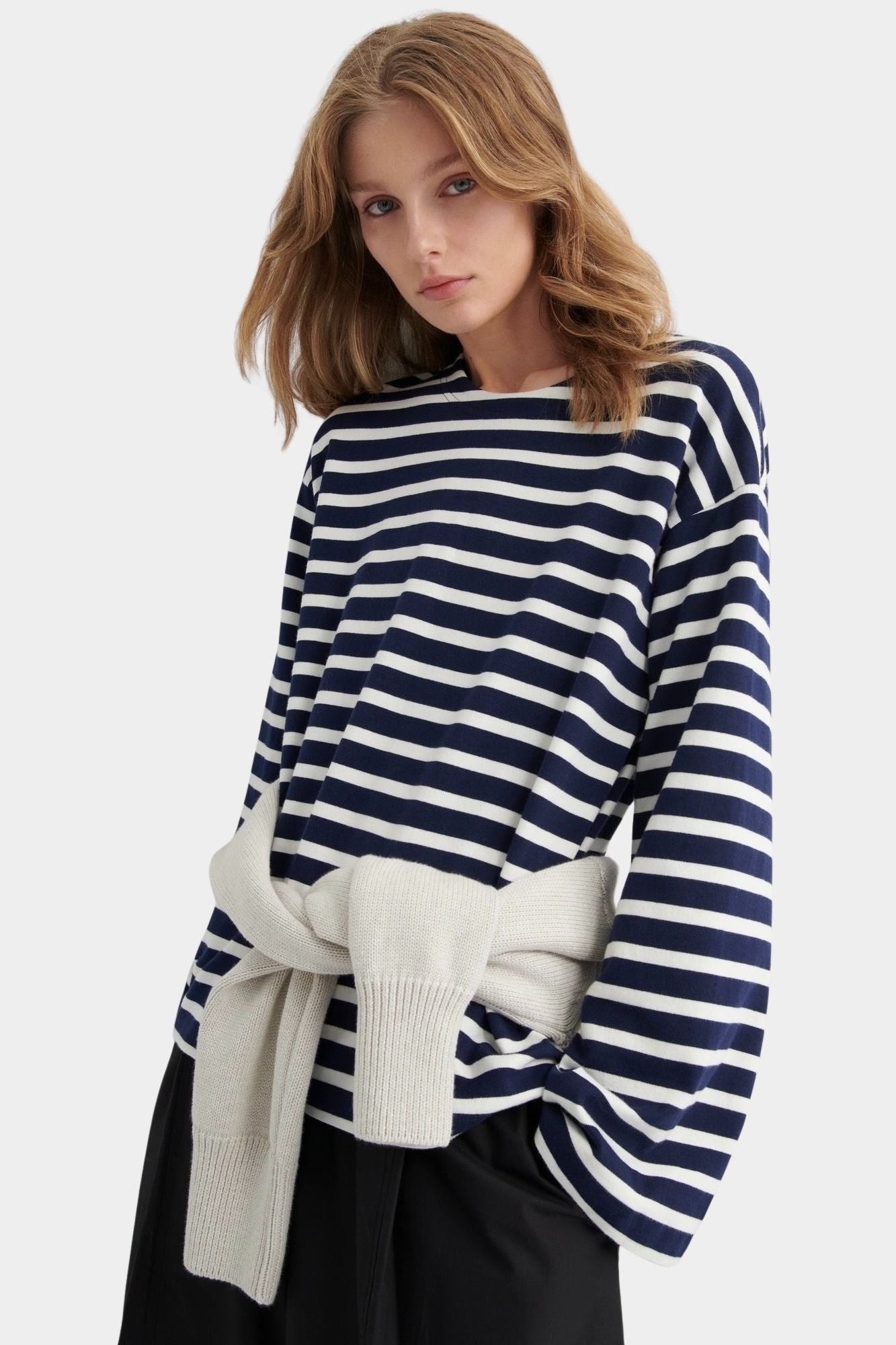 kowtow pierre tee uniform stripe navy ivory striped long sleeve tee relaxed silhouette styled with sweater tied at waist