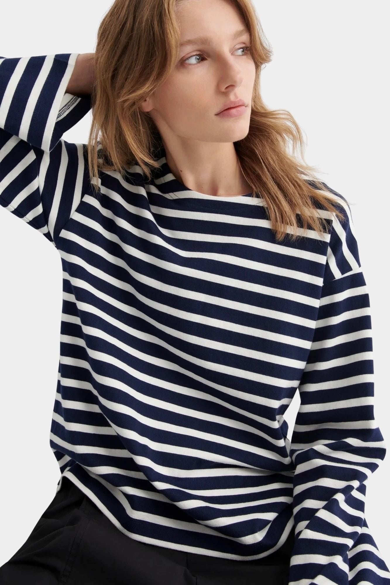 kowtow pierre tee uniform stripe navy and ivory striped organic cotton long sleeve tee close model portrait