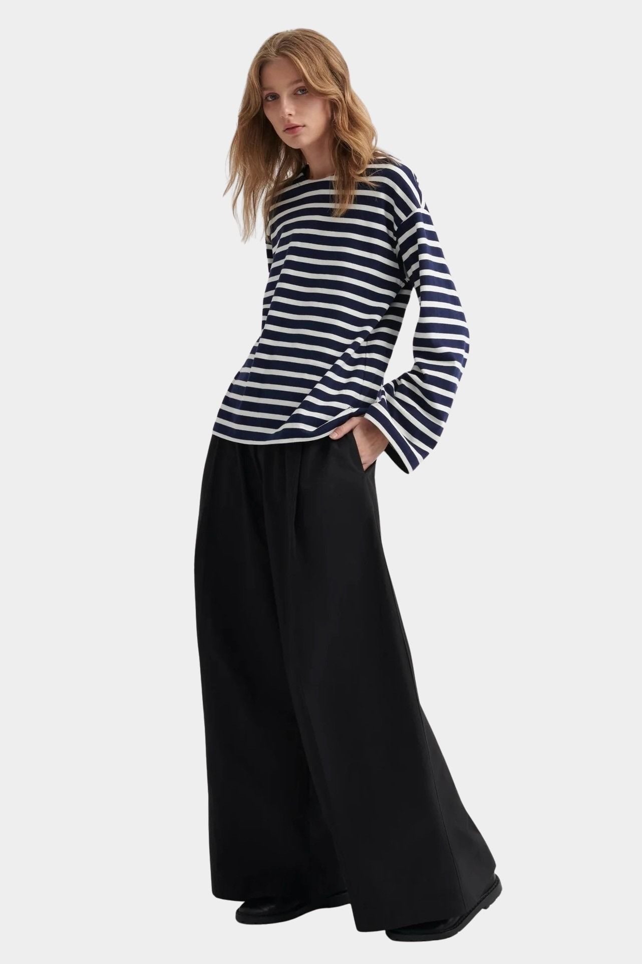 kowtow pierre tee uniform stripe organic cotton striped long sleeve tee relaxed fit worn with wide leg black trousers