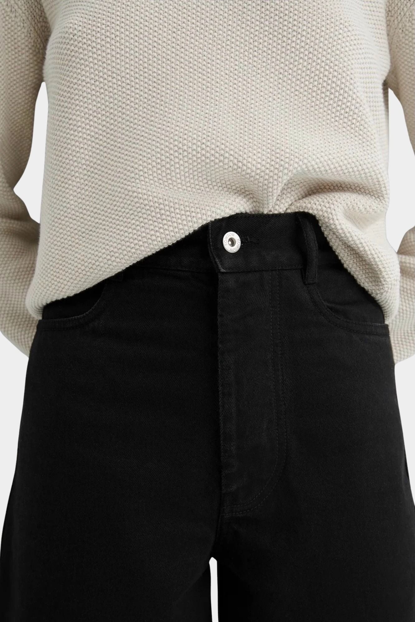Kowtow Sailor Jeans in black close up showing high rise waist and button closure detail