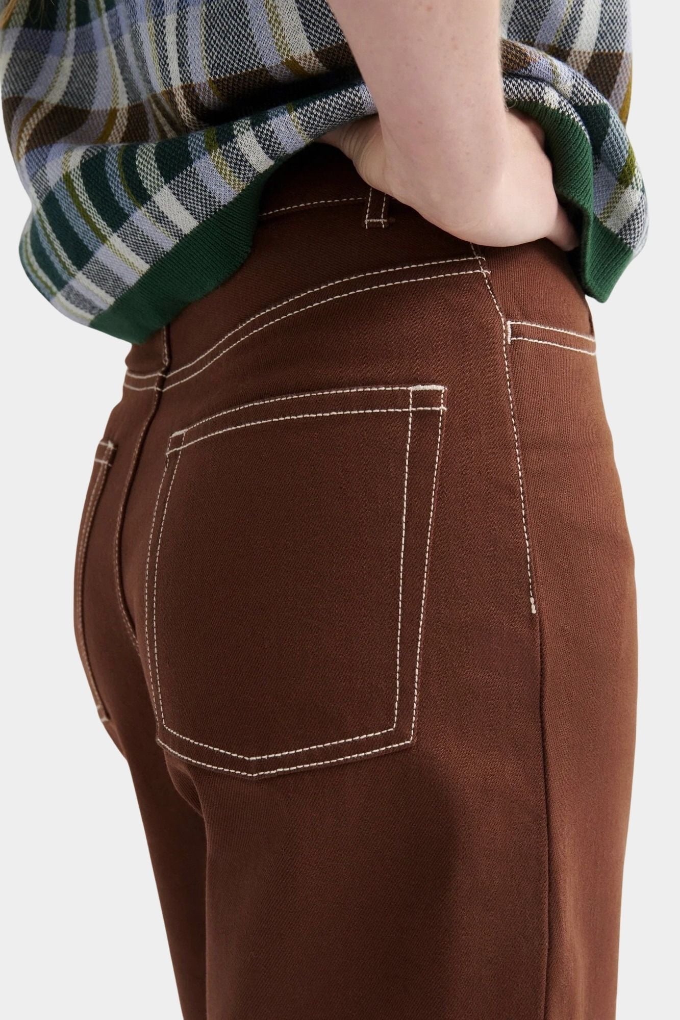 Kowtow Unity Jeans in brown denim close up back pocket detail with contrast stitching