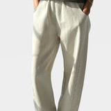 Le Bon Shoppe Arc Pants Naturel styled with an olive tank and yellow sandals at YUCCA Denver