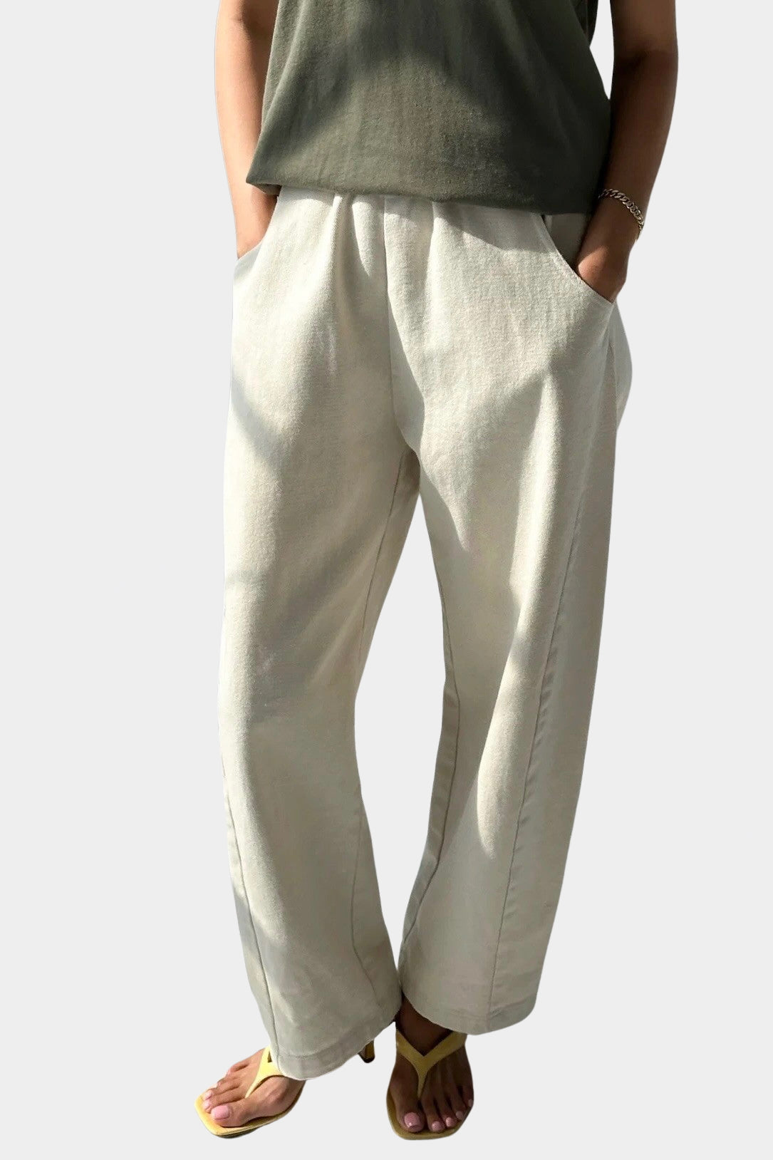Le Bon Shoppe Arc Pants Naturel styled with an olive tank and yellow sandals at YUCCA Denver