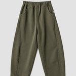 Le Bon Shoppe Arc Pants in olive flat lay showing elastic waistband, oversized front pockets and curved leg silhouette. Available at YUCCA Denver.