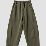 Le Bon Shoppe Arc Pants in olive flat lay showing elastic waistband, oversized front pockets and curved leg silhouette. Available at YUCCA Denver.