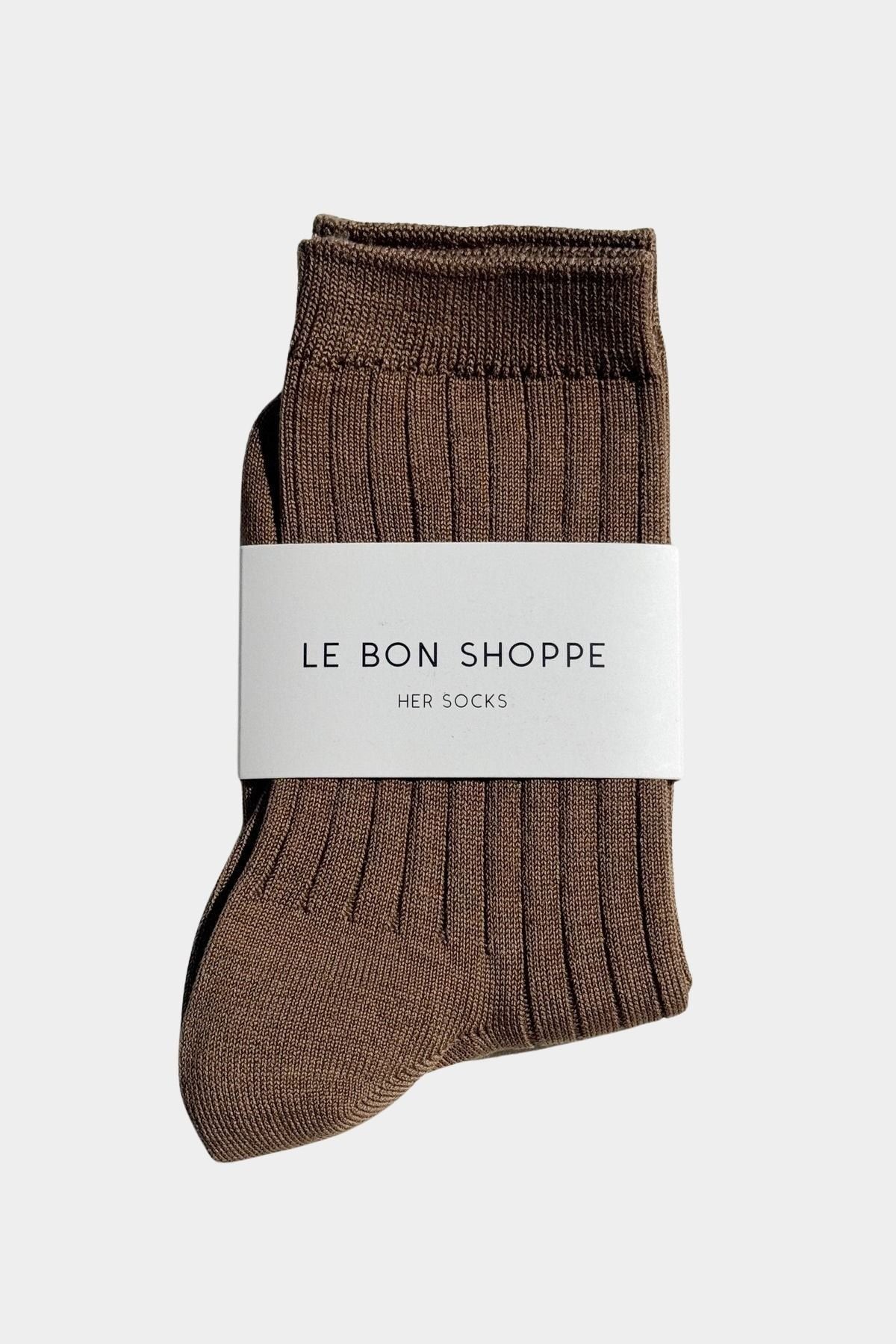 Le Bon Shoppe Her Socks in Dark Tan folded with branded paper band, showing brown ribbed cotton at YUCCA Denve