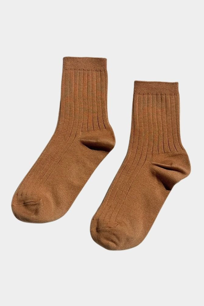Pair of Peanut Butter Her Socks by Le Bon Shoppe showing warm brown color, fine ribbing and quarter crew length