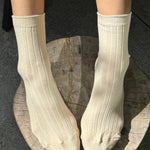 Le Bon Shoppe Porcelain Her Socks worn with classic ribbed cuffs and a soft cotton texture