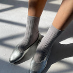 Close-up of Le Bon Shoppe Her Socks in Stone worn with silver ballet flats, highlighting ribbed texture and fit.