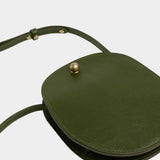 LINDQUIST Eggi bag in Olive laid flat, showing its oval leather body, side gusset, and adjustable strap