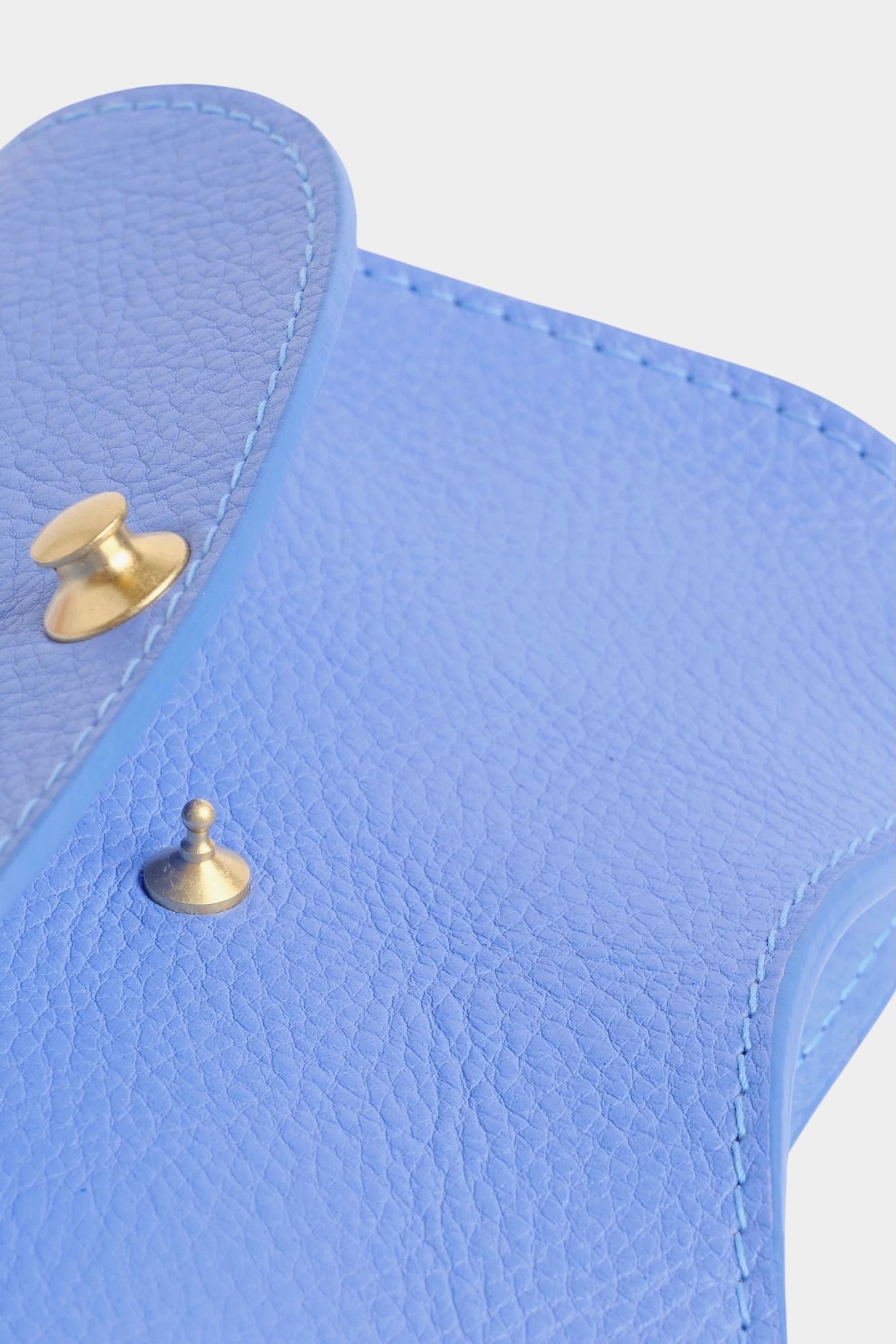 Lindquist Faba bag periwinkle leather interior detail with brass hardware closure