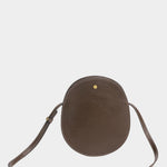 LINDQUIST Mini Eggi leather bag in Chaga with an oval silhouette, tonal stitching, and spherical brass snap