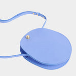 Lindquist Mini Eggi periwinkle leather bag angled view with adjustable strap detail