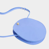 Lindquist Mini Eggi periwinkle leather bag angled view with adjustable strap detail