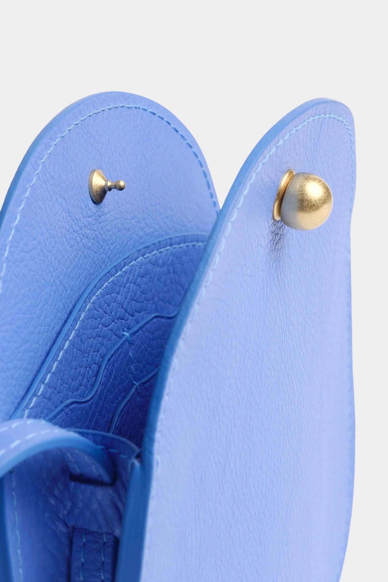 Lindquist Mini Eggi periwinkle leather bag interior close up showing snap hardware