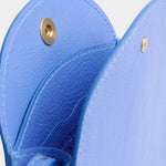 Lindquist Mini Eggi periwinkle leather bag interior view with snap closure and compartment