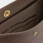 Interior leather card pockets and tonal stitching inside the LINDQUIST Savoie bag in Chaga