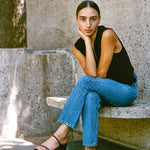 LOQ Gael black leather heeled sandal worn with straight leg jeans outdoor seated