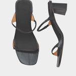 LOQ Gael heeled sandal black leather square toe tubular strap block heel top view