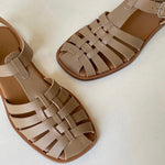 LOQ Rio sandal in taupe leather fisherman sandal close up angled view showing woven straps and square toe