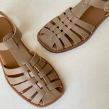 LOQ Rio sandal in taupe leather fisherman sandal close up angled view showing woven straps and square toe