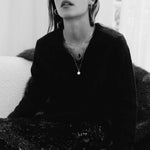 Model wearing 10K gold herringbone chain necklace.