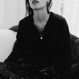 Model wearing 10K gold herringbone chain necklace.