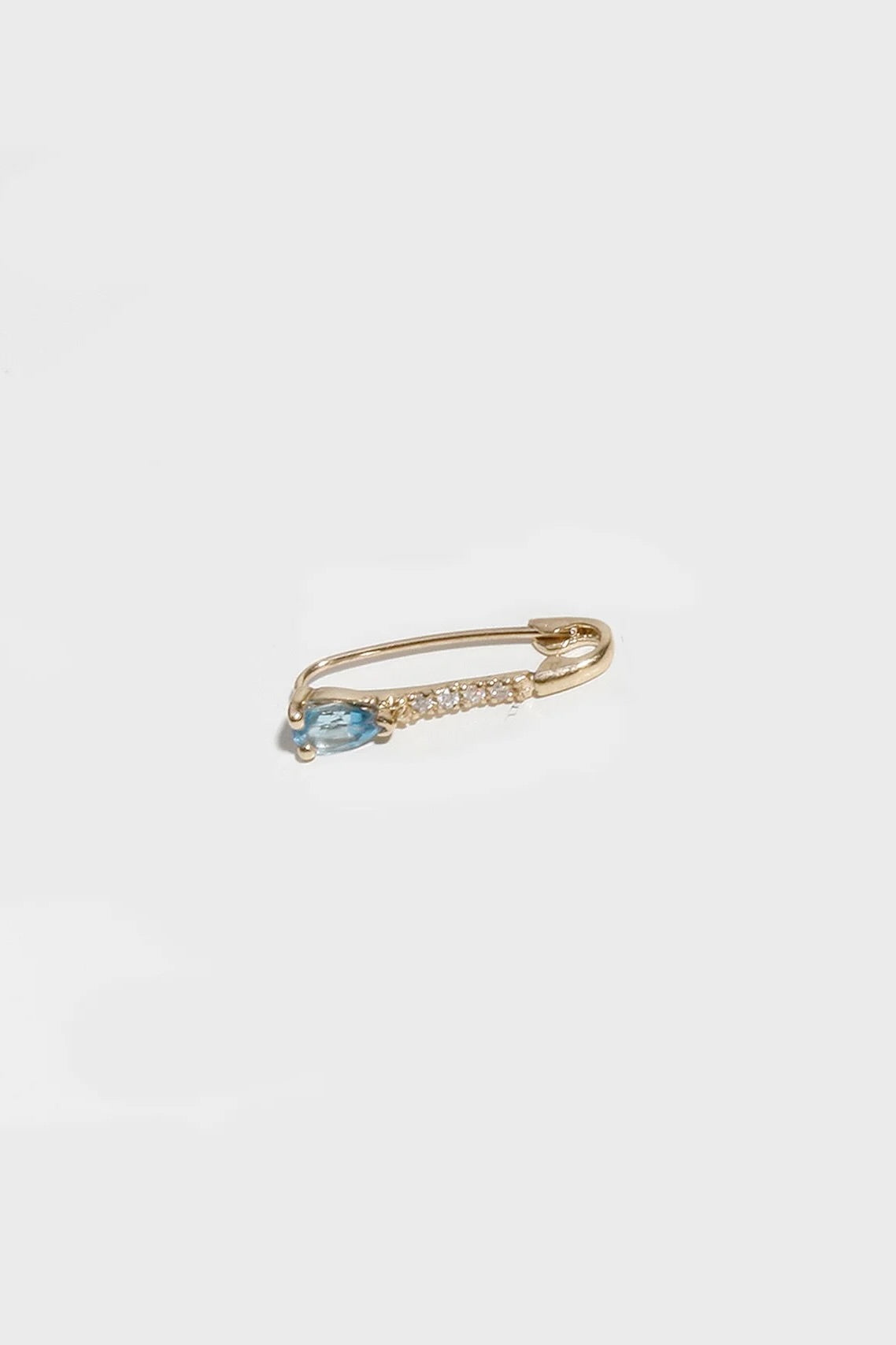 14K gold hoop earring with blue topaz drop and secure clasp closure.