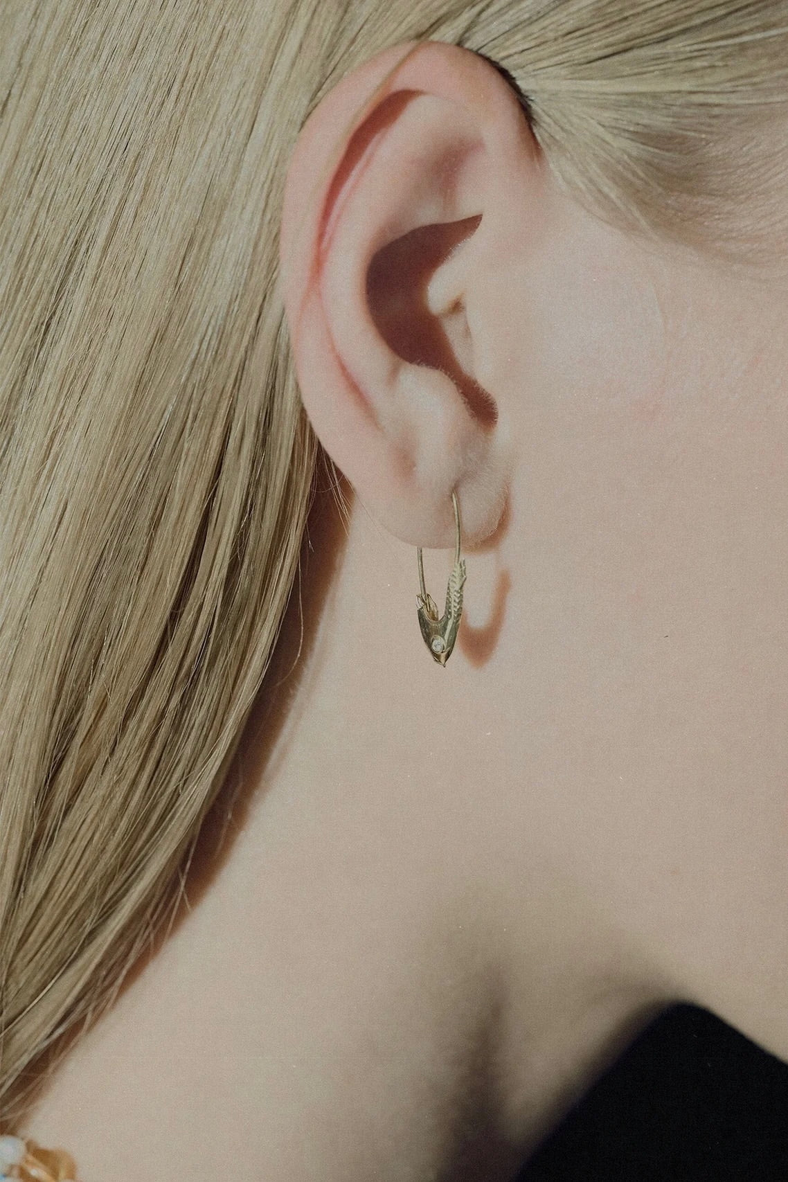 Loren Stewart Pisces Safety Pin Earring in 14k yellow gold worn on the ear