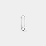 Closed Loren Stewart sterling silver Safety Pin Earring against a light gray background.