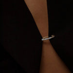 Model wearing 14K gold freshwater pearl bead hoop earring.